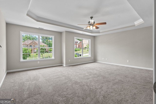1429 Kentmire Ct, Locust Grove, GA 30248 - carpeted spare room featuring a tray ceiling, a ceiling fan, baseboards, and crown molding