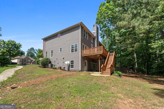1429 Kentmire Ct, Locust Grove, GA 30248 - rear view of property featuring a deck, a chimney, stairs, a lawn, and central AC