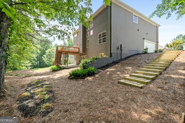 1429 Kentmire Ct, Locust Grove, GA 30248 - view of property exterior featuring stairway and a wooden deck