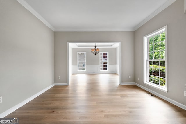 1429 Kentmire Ct, Locust Grove, GA 30248 - unfurnished room featuring a chandelier, light wood finished floors, crown molding, and baseboards