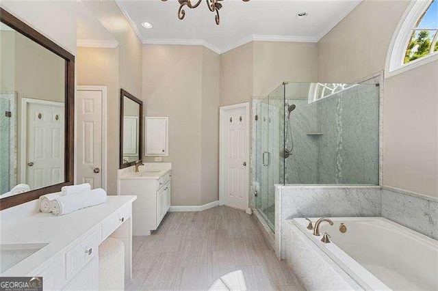 full bathroom with a stall shower, a garden tub, two vanities, crown molding, and baseboards