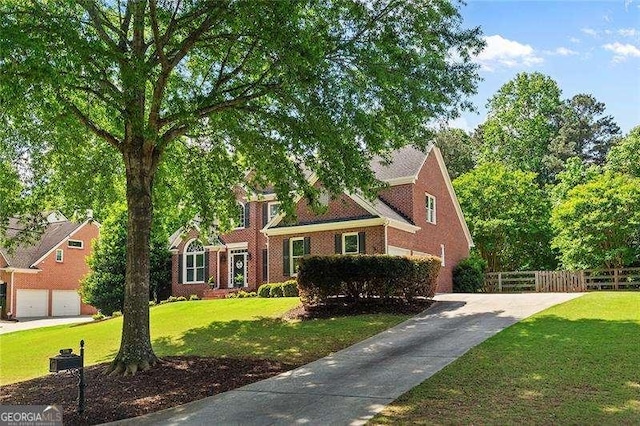 colonial home featuring brick siding