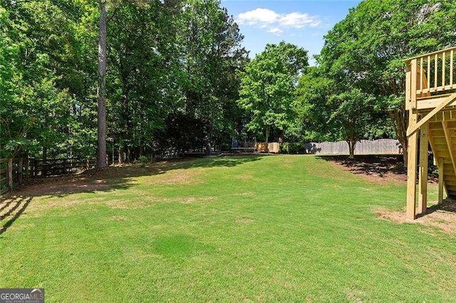 view of yard featuring a wooden deck