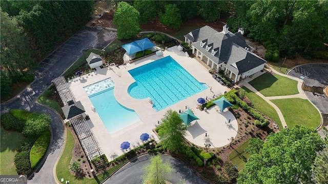 view of subject property featuring a pool area
