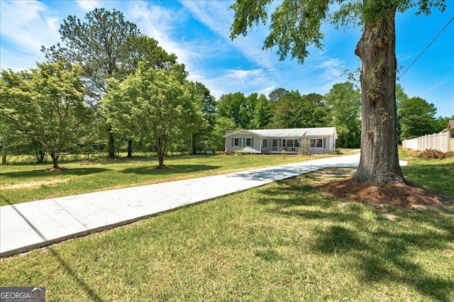 view of front of home featuring a front lawn
