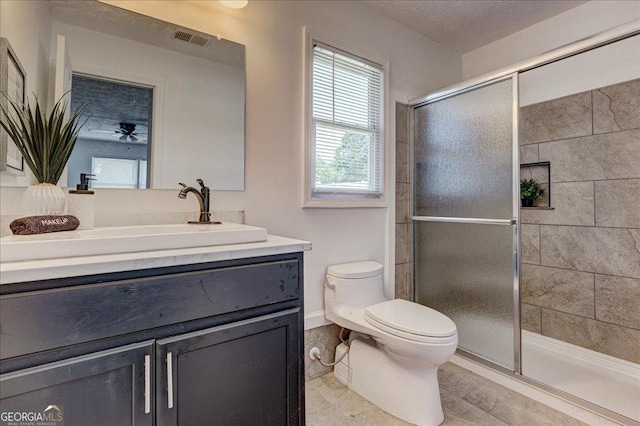 203 Brannan Rd, Mcdonough, GA 30253 - full bathroom featuring toilet, a stall shower, vanity, and ceiling fan