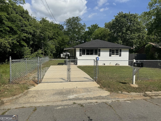 bungalow featuring a gate and driveway
