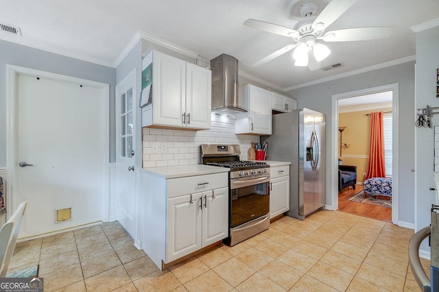 kitchen with stainless steel appliances, wall chimney range hood, a ceiling fan, ornamental molding, and backsplash