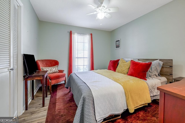 bedroom with wood finished floors and a ceiling fan