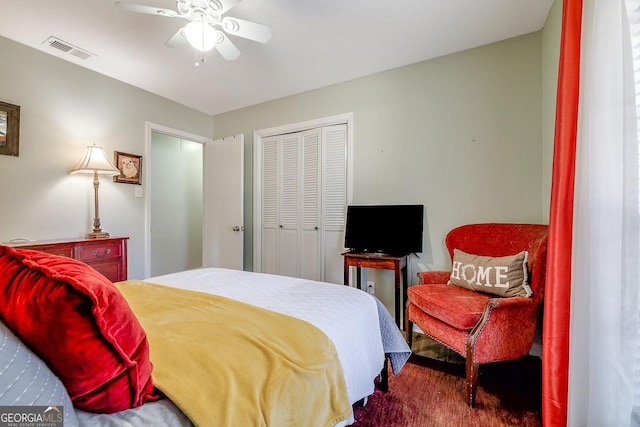carpeted bedroom with a closet and ceiling fan