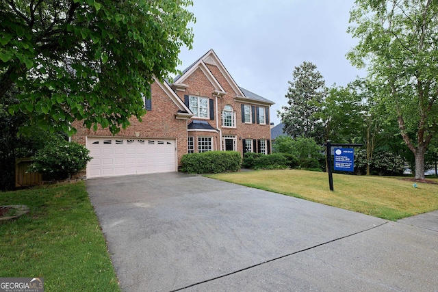 1425 Turtle Dove Ln, Lawrenceville, GA 30043 - view of front of house featuring driveway, brick siding, and a front yard