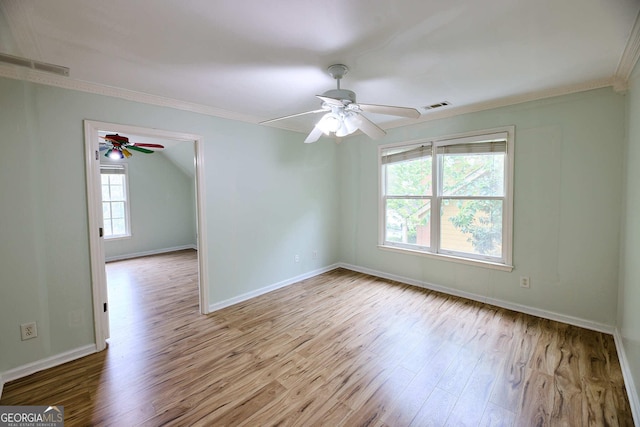 1425 Turtle Dove Ln, Lawrenceville, GA 30043 - spare room with crown molding, wood finished floors, and ceiling fan