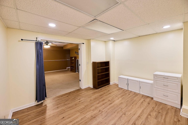 1425 Turtle Dove Ln, Lawrenceville, GA 30043 - finished below grade area with light wood-style flooring, a drop ceiling, and recessed lighting