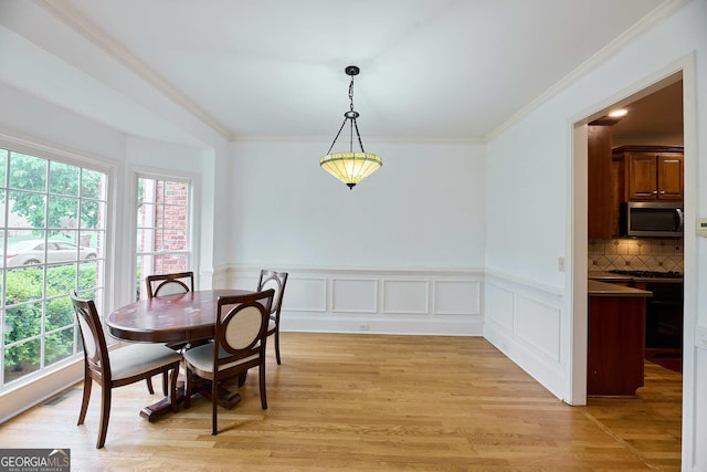 1425 Turtle Dove Ln, Lawrenceville, GA 30043 - dining space with ornamental molding, light wood-style flooring, and wainscoting