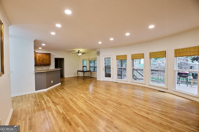 1425 Turtle Dove Ln, Lawrenceville, GA 30043 - unfurnished living room featuring recessed lighting, a ceiling fan, light wood finished floors, and healthy amount of natural light