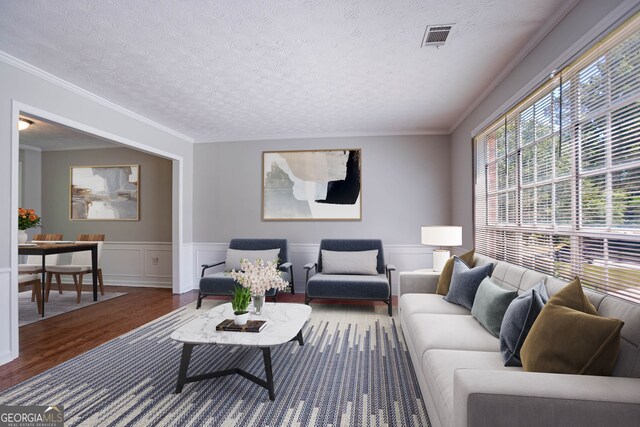 1076 Plantation Blvd SE, Conyers, GA 30094 - unfurnished room with wood finished floors, a textured ceiling, a wainscoted wall, ornamental molding, and a decorative wall