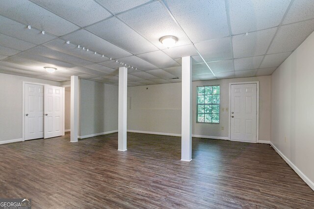 1076 Plantation Blvd SE, Conyers, GA 30094 - below grade area with baseboards, wood finished floors, and a drop ceiling