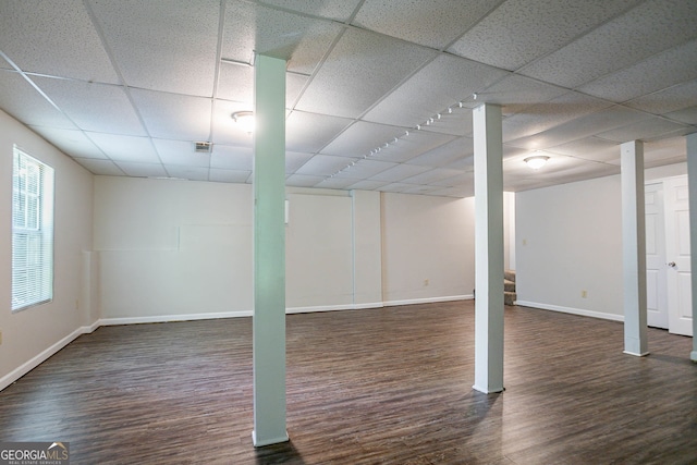 1076 Plantation Blvd SE, Conyers, GA 30094 - below grade area with a drop ceiling and wood finished floors