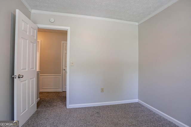 1076 Plantation Blvd SE, Conyers, GA 30094 - spare room with carpet flooring, crown molding, and a textured ceiling