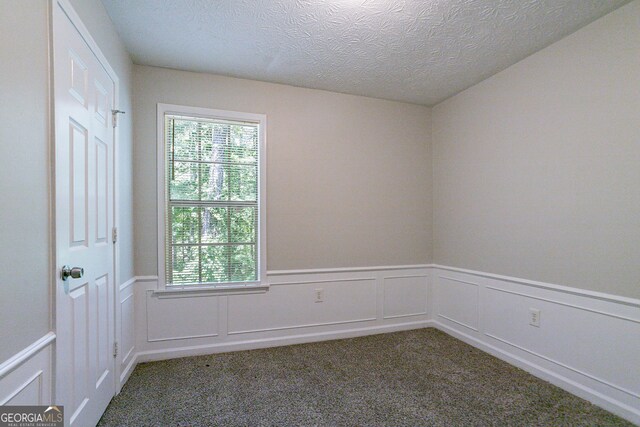 1076 Plantation Blvd SE, Conyers, GA 30094 - full bathroom featuring toilet, vanity,  shower combination, and a textured ceiling