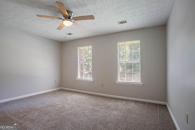 1076 Plantation Blvd SE, Conyers, GA 30094 - carpeted spare room featuring a ceiling fan and a textured ceiling