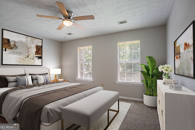 1076 Plantation Blvd SE, Conyers, GA 30094 - bedroom featuring light carpet, a textured ceiling, and a ceiling fan