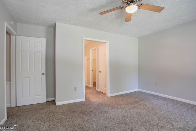 1076 Plantation Blvd SE, Conyers, GA 30094 - unfurnished bedroom featuring a textured ceiling, carpet floors, and a ceiling fan