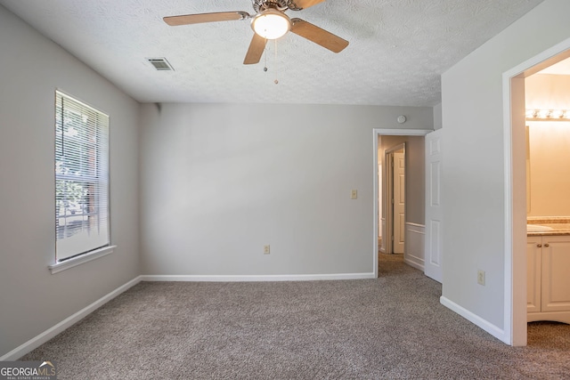 1076 Plantation Blvd SE, Conyers, GA 30094 - empty room featuring carpet flooring, a textured ceiling, and ceiling fan
