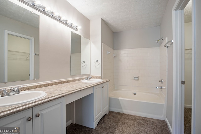 1076 Plantation Blvd SE, Conyers, GA 30094 - bathroom with tub / shower combination, double vanity, a textured ceiling, and a walk in closet