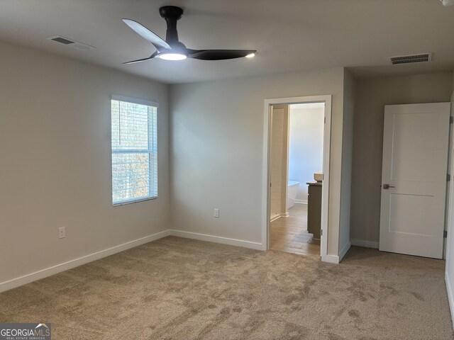 5314 Tolar Rd Unit 23, South Fulton, GA 30213 - unfurnished bedroom with carpet, baseboards, and a ceiling fan