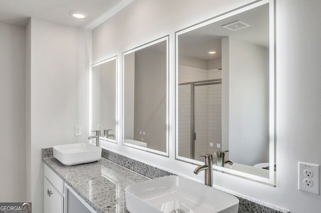 5314 Tolar Rd Unit 23, South Fulton, GA 30213 - bathroom featuring a shower stall, double vanity, and recessed lighting