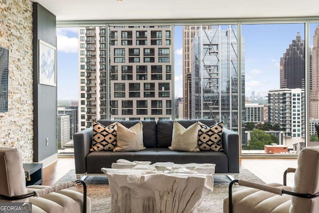 20 10th St NW Unit 2003, Atlanta, GA 30309 - living room featuring a wall of windows, wood finished floors, healthy amount of natural light, and a city view