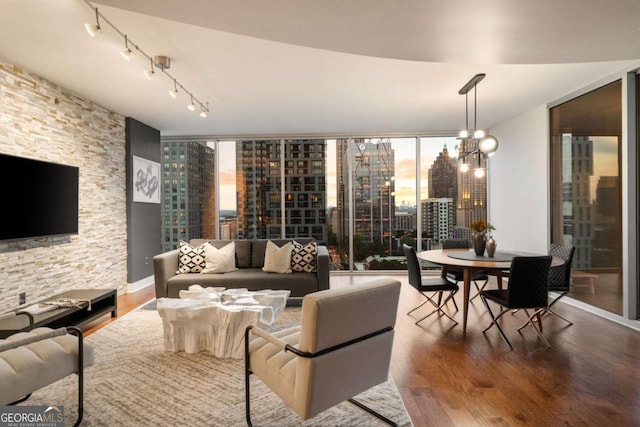 20 10th St NW Unit 2003, Atlanta, GA 30309 - living room featuring a city view, wood finished floors, and track lighting