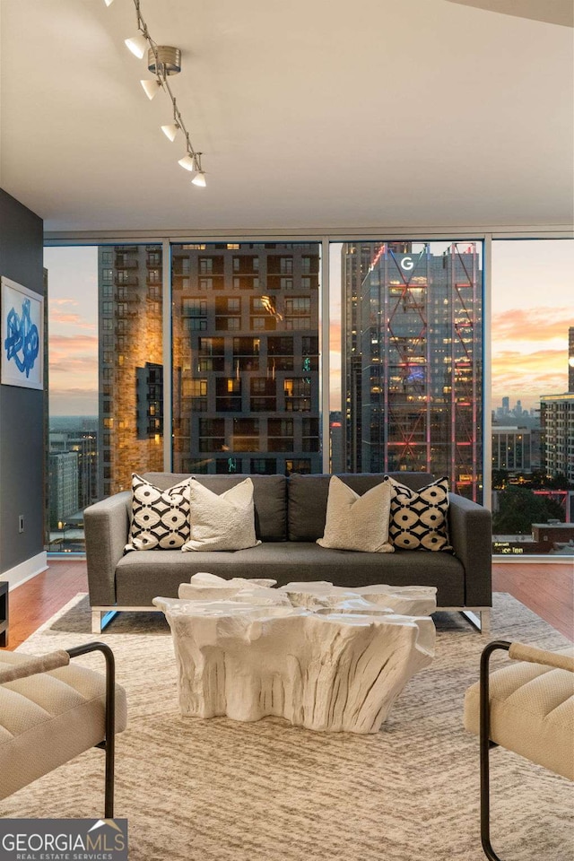 20 10th St NW Unit 2003, Atlanta, GA 30309 - living area featuring expansive windows, wood finished floors, a city view, and rail lighting