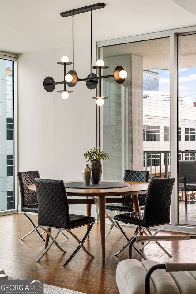 20 10th St NW Unit 2003, Atlanta, GA 30309 - dining space with expansive windows and wood finished floors