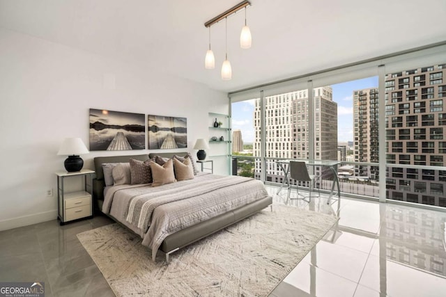 20 10th St NW Unit 2003, Atlanta, GA 30309 - bedroom featuring a view of city, floor to ceiling windows, and baseboards