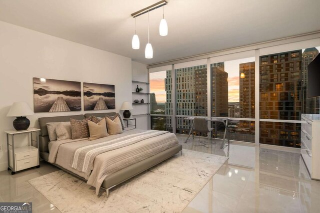 20 10th St NW Unit 2003, Atlanta, GA 30309 - bedroom featuring marble tiled floors and floor to ceiling windows