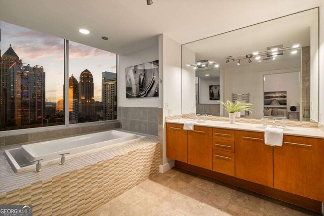 20 10th St NW Unit 2003, Atlanta, GA 30309 - bathroom with a bath, vanity, tile patterned flooring, and a city view