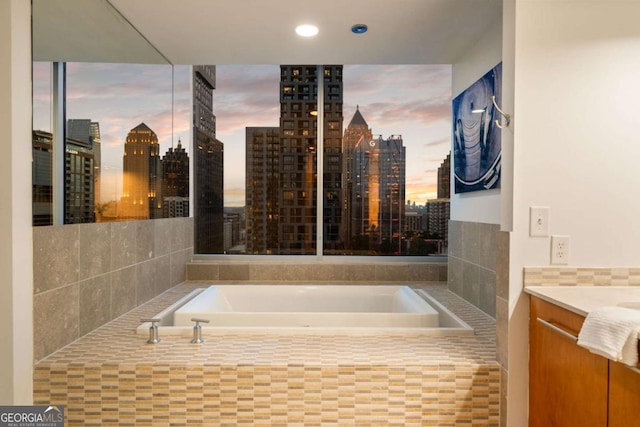 20 10th St NW Unit 2003, Atlanta, GA 30309 - full bath with a skyline view, a garden tub, recessed lighting, and vanity