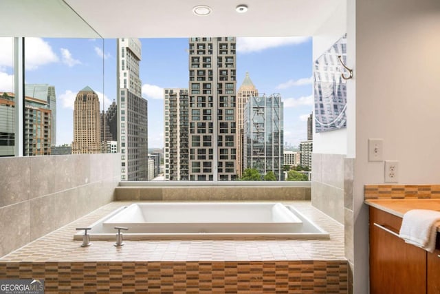 20 10th St NW Unit 2003, Atlanta, GA 30309 - bathroom with a bath and a skyline view