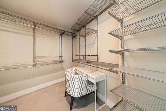 20 10th St NW Unit 2003, Atlanta, GA 30309 - walk in closet featuring tile patterned flooring