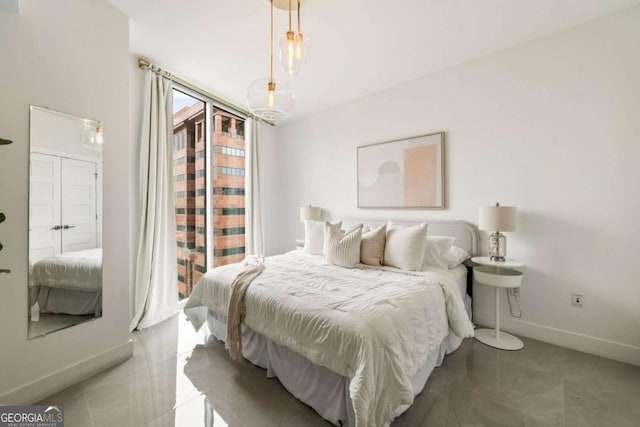 20 10th St NW Unit 2003, Atlanta, GA 30309 - bedroom with access to exterior and baseboards