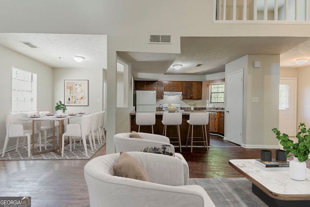 1074 Cherokee Hts, Stone Mountain, GA 30083 - living area featuring dark wood finished floors and baseboards