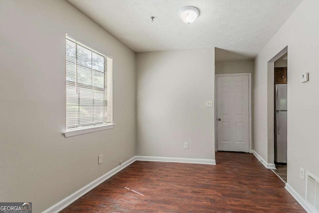 1074 Cherokee Hts, Stone Mountain, GA 30083 - empty room featuring wood finished floors and fire sprinkler in ceiling