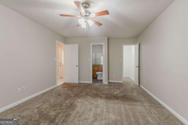 1074 Cherokee Hts, Stone Mountain, GA 30083 - unfurnished bedroom featuring carpet flooring, connected bathroom, and a ceiling fan