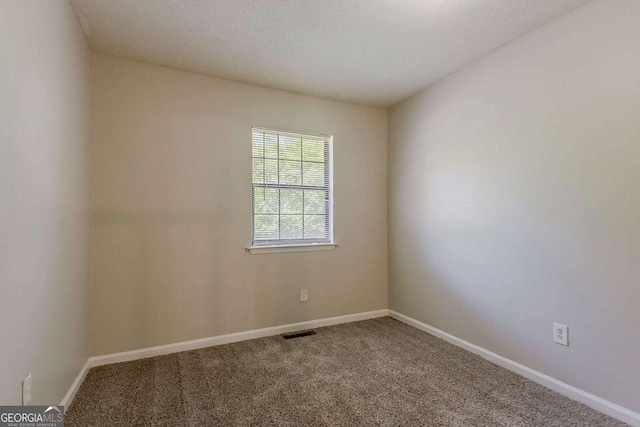 1074 Cherokee Hts, Stone Mountain, GA 30083 - carpeted spare room with baseboards