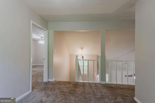 1074 Cherokee Hts, Stone Mountain, GA 30083 - carpeted empty room with a textured ceiling and baseboards