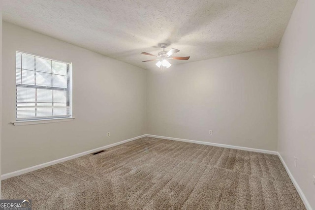 1074 Cherokee Hts, Stone Mountain, GA 30083 - carpeted empty room with a ceiling fan and a textured ceiling