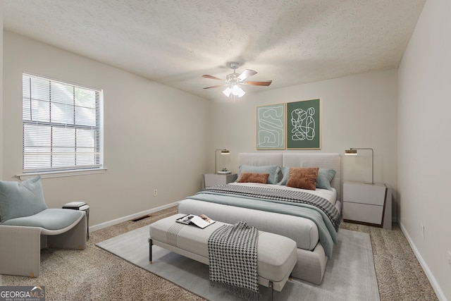 1074 Cherokee Hts, Stone Mountain, GA 30083 - bedroom featuring carpet flooring, a textured ceiling, and ceiling fan
