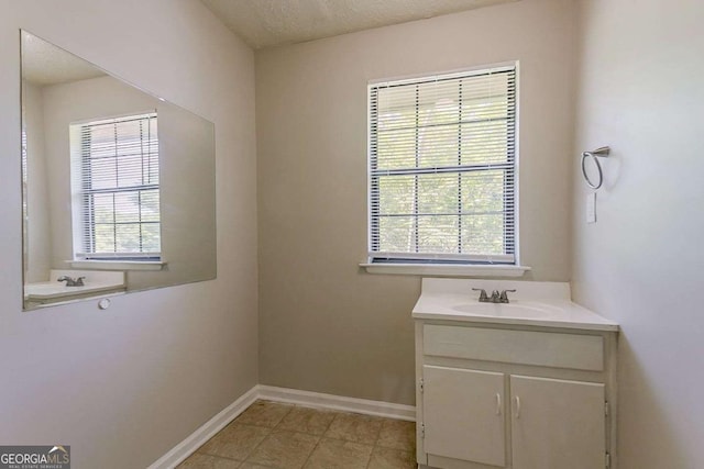 1074 Cherokee Hts, Stone Mountain, GA 30083 - bathroom with vanity, tile patterned flooring, and a textured ceiling